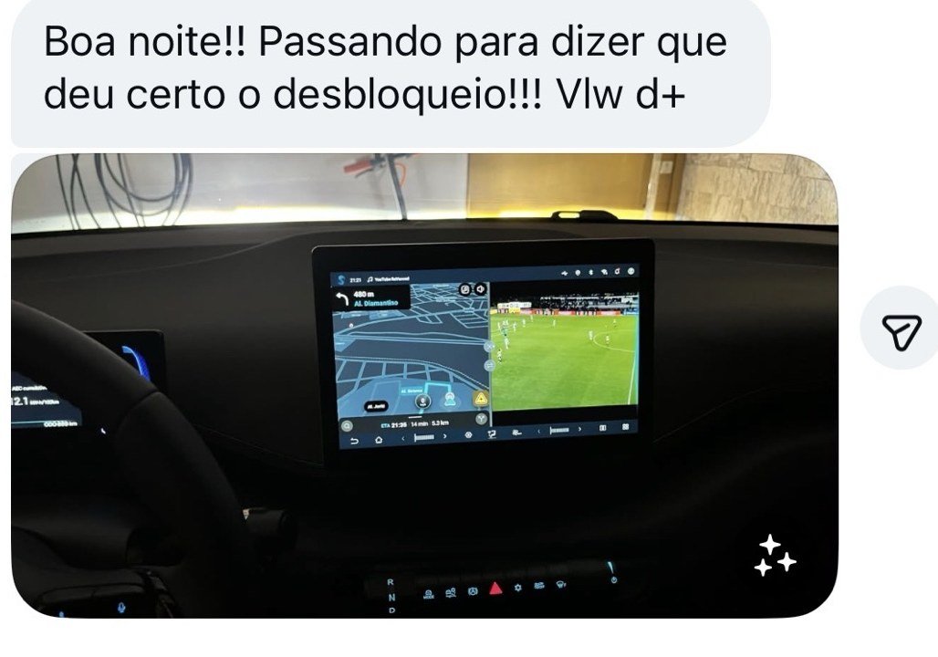 Cliente avisando que o desbloqueio deu certo, com foto da central com navegação e vídeo ao mesmo tempo